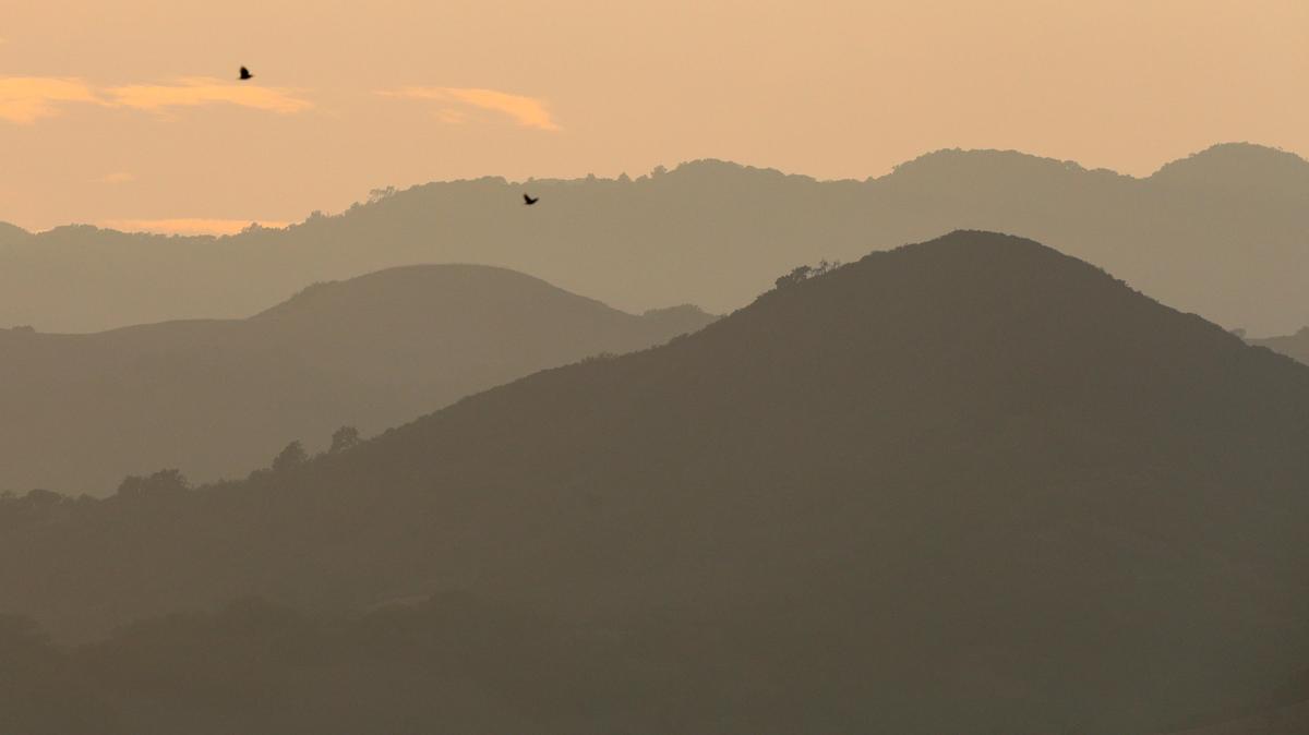 Smoke creates a hazy sky over the Irish Hills in San Luis Obispo just before sunset in 2018.