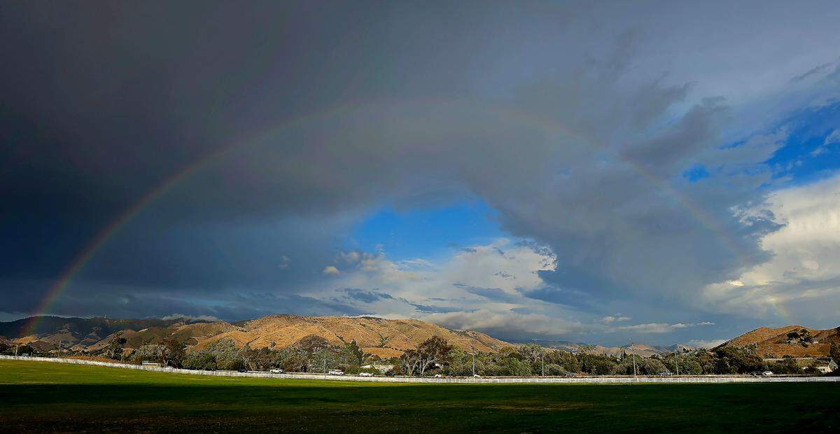 A full rainbow was visible from Madonna Inn in San Luis Obispo, California as sudden thunderstorms swept across San Luis Obispo County.