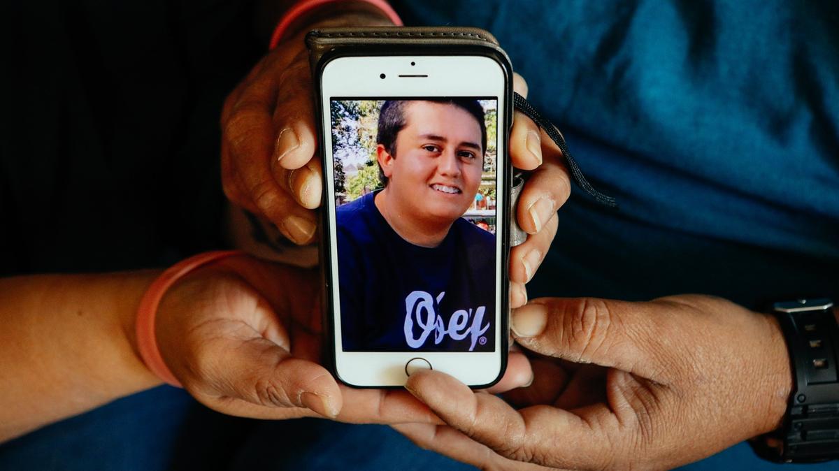 21-year-old Jose Montes Guillen died while reportedly trying to prevent a woman from driving while intoxicated near Santa Maria Brewing Co. in Paso Robles, here his parents Armando and Gabriela hold of photo of him. Photo by Joe Johnston 01-03-19