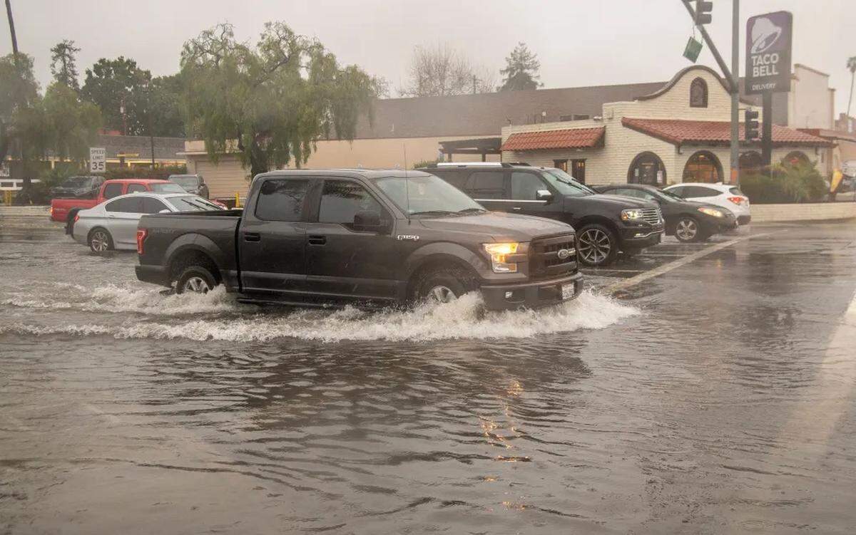 The intersection of Hollister and Fairview avenues floods in Goleta Sunday afternoon.