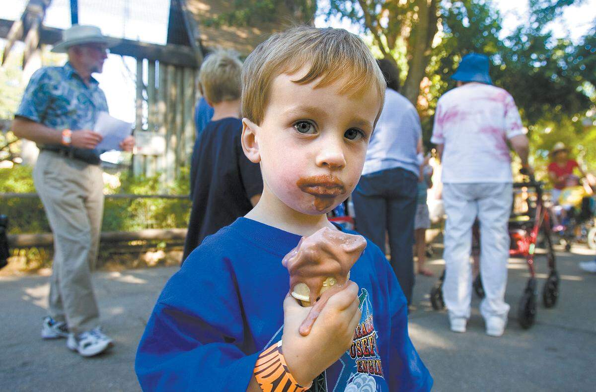 Elijah Ecret, 3, of Santa Margarita enjoys a melting ice cream cone at the Ice Cream Zoofari at Charles Paddock Zoo in Atascadero in 2009. The event returns to the zoo on July 14.