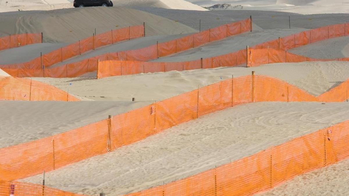 Fencing at Oceano Dunes State Vehicular Recreation Area was installed to control blowing dust. The fences slow winds and drop airborne sand to to the ground.