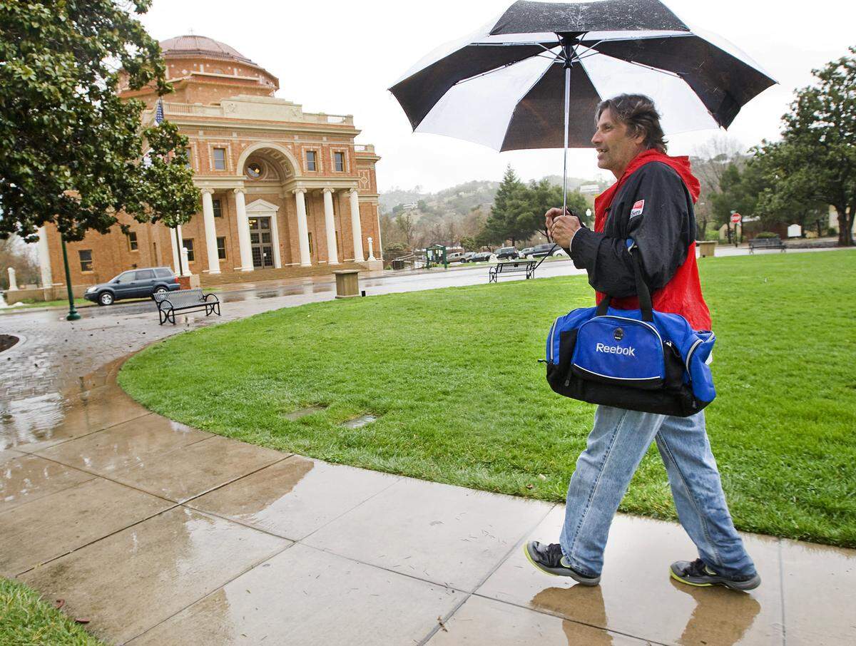 Anthony Ermoian was prepared for the wet weather while walking through the Sunken Gardens in Atascadero. Wet weather is expected Wednesday in SLO County.