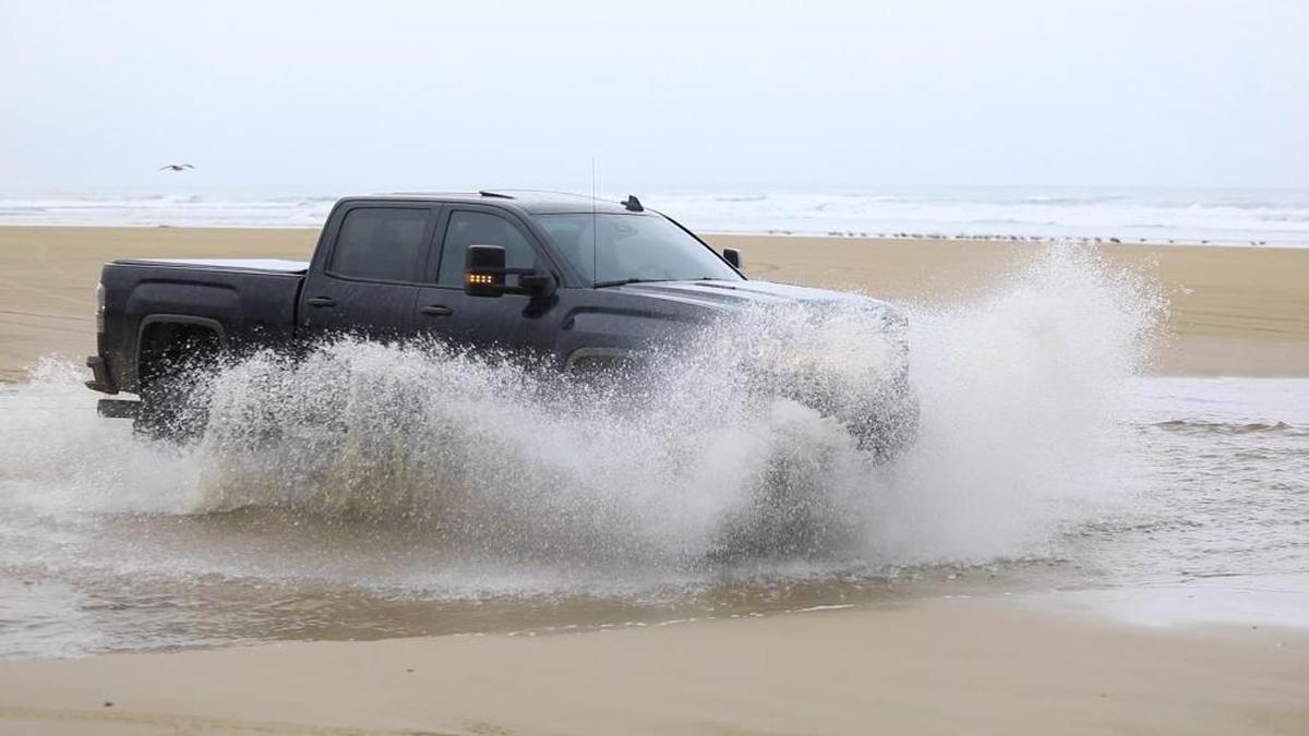 A vehicle crosses Arroyo Grande Creek at the Oceano Dunes State Vehicular Recreation Area.