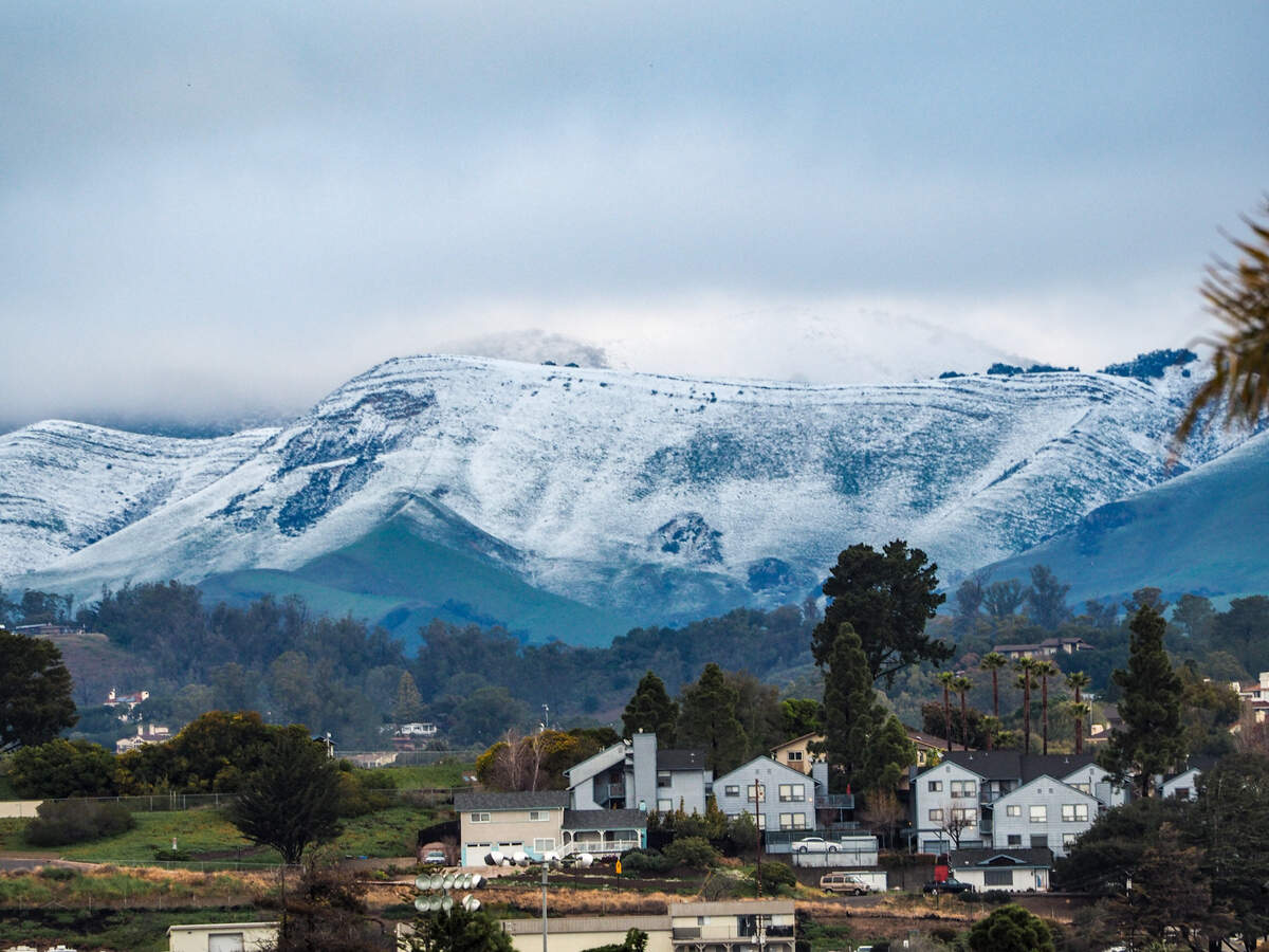Snow dusts the hills in south San Luis Obispo County in a view from Grover Beach on Saturday, Feb. 25, 2023.