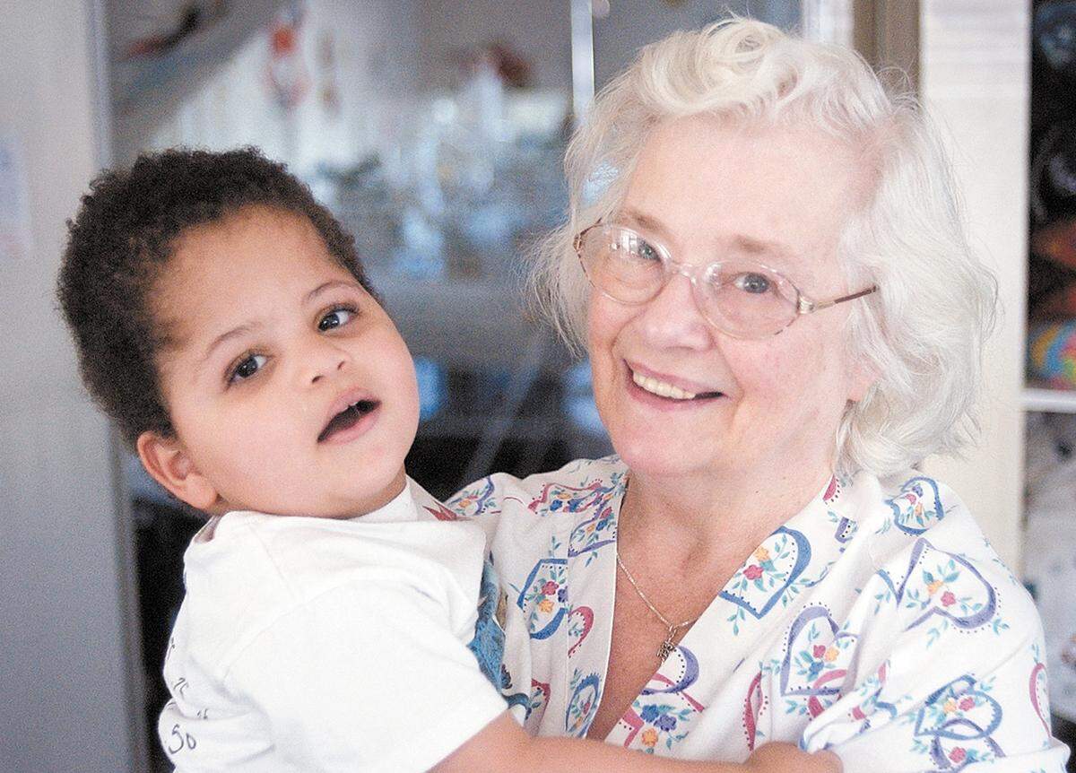 Sjany de Groot holds 2-year-old Joe on Nov. 20, 2002, at her home in San Luis Obispo. She started caring for him when he was 2 months old.