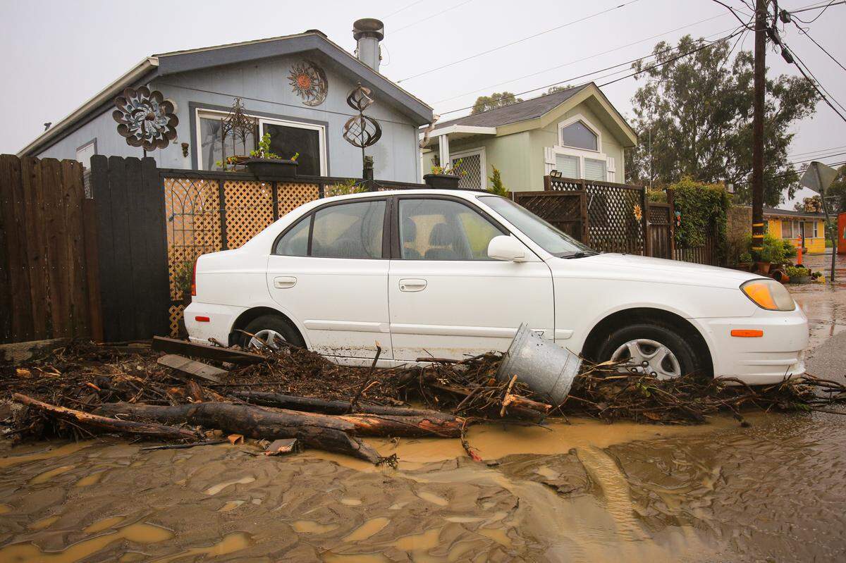 Floodwaters hit the Silver City Mobile Home Park in Morro Bay again, bringing debris to rest against the side of this car on March 10, 2023.