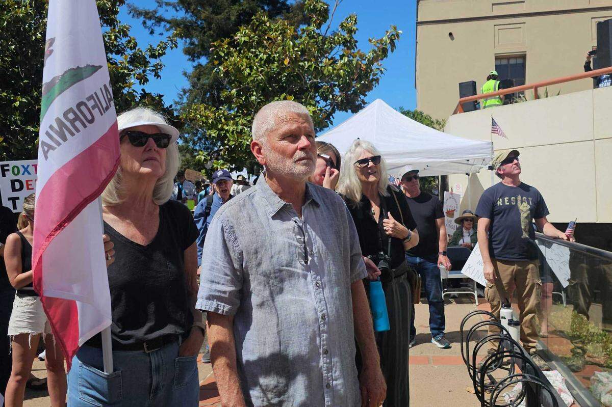 Thousands gathered in San Luis Obispo for No Kings Day to protest executive overreach by the Trump administration on the President’s birthday. County Supervisor Bruce Gibson watches the protest. 
