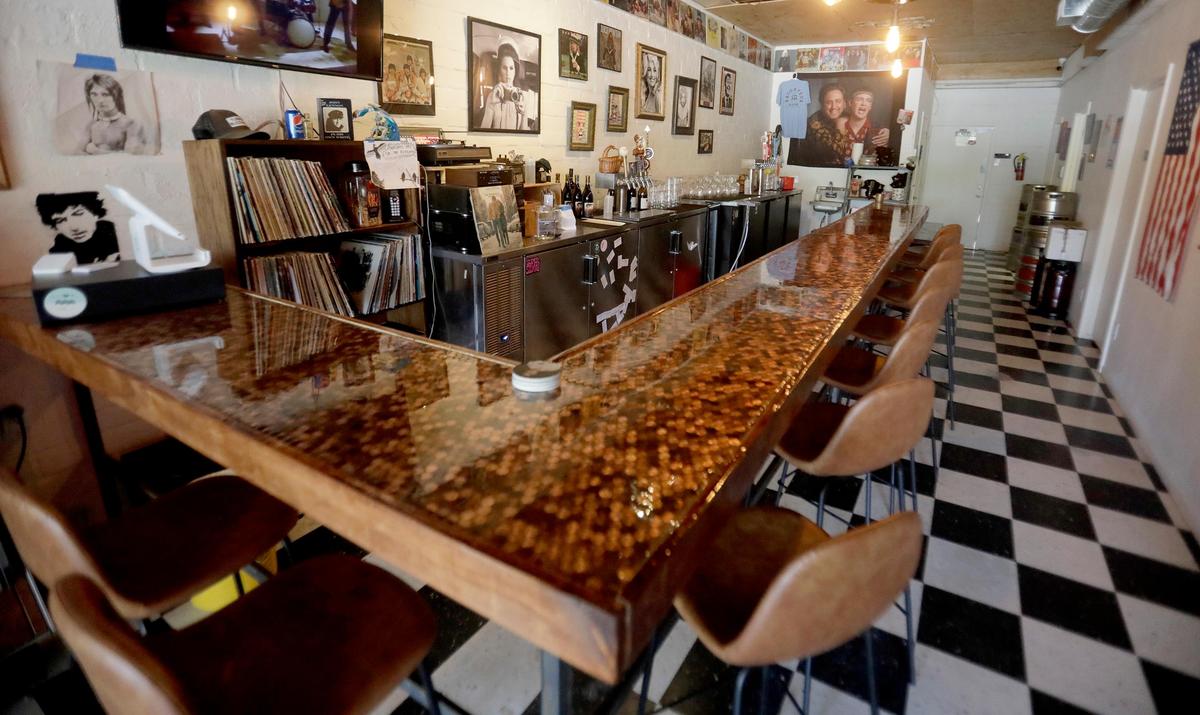The Raconteur Room, a new wine and beer bar near in downtown Atascadero, opened in May. The bar is festooned with pennies embedded in epoxy, giving it a warm glow.