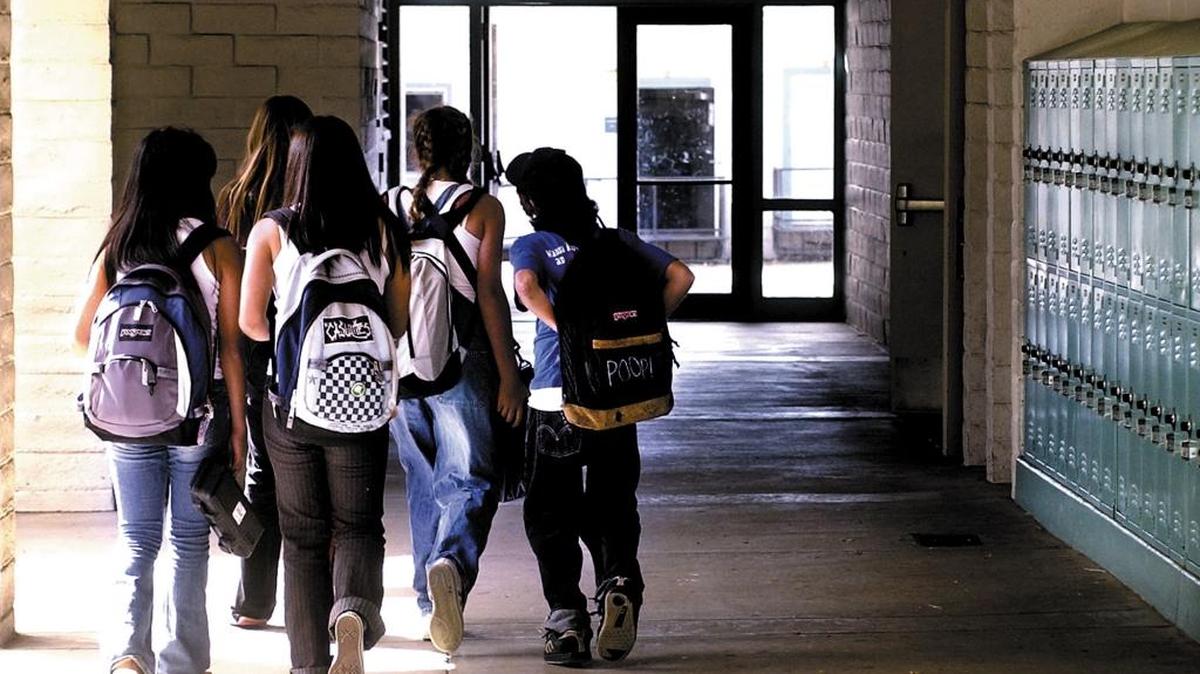 Students leave Los Osos Middle School at the end of their day with their homework.
