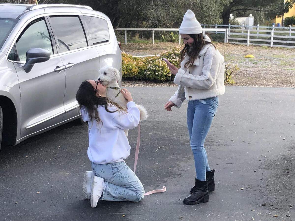 Tuti jumps into the arms of Nour Makhoul as the two are reunited in San Luis Obispo in January 2024. It was the first time Makhoul had seen her beloved pet since the two were separated when Makhoul fled Syria in April 2023.
