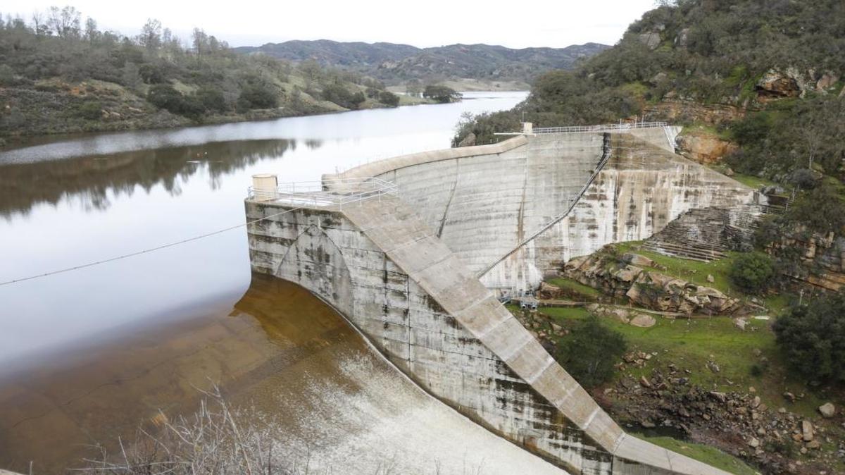 Water falls through the Salinas Dam spillway after Santa Margarita Lake filled for the first time in years in February 2017.