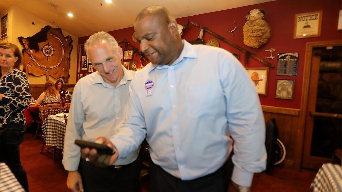 John Shoals and Jeff Lee look over results Tuesday night in Grover Beach.