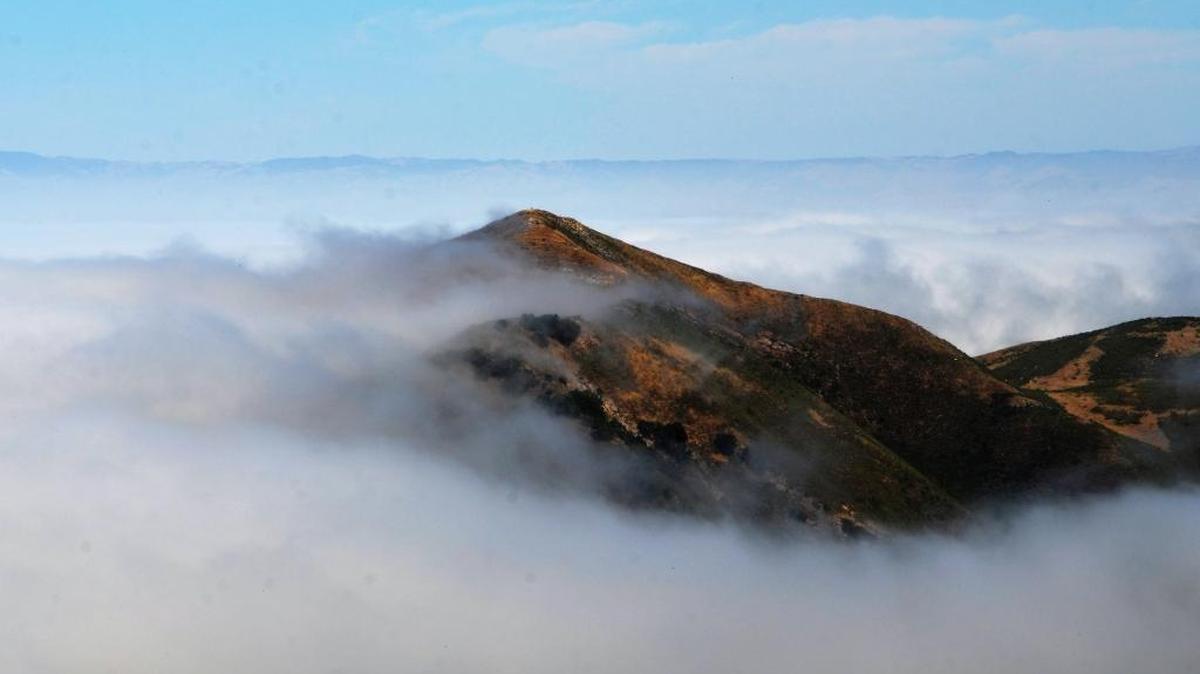 Valencia Peak is shrouded in fog.