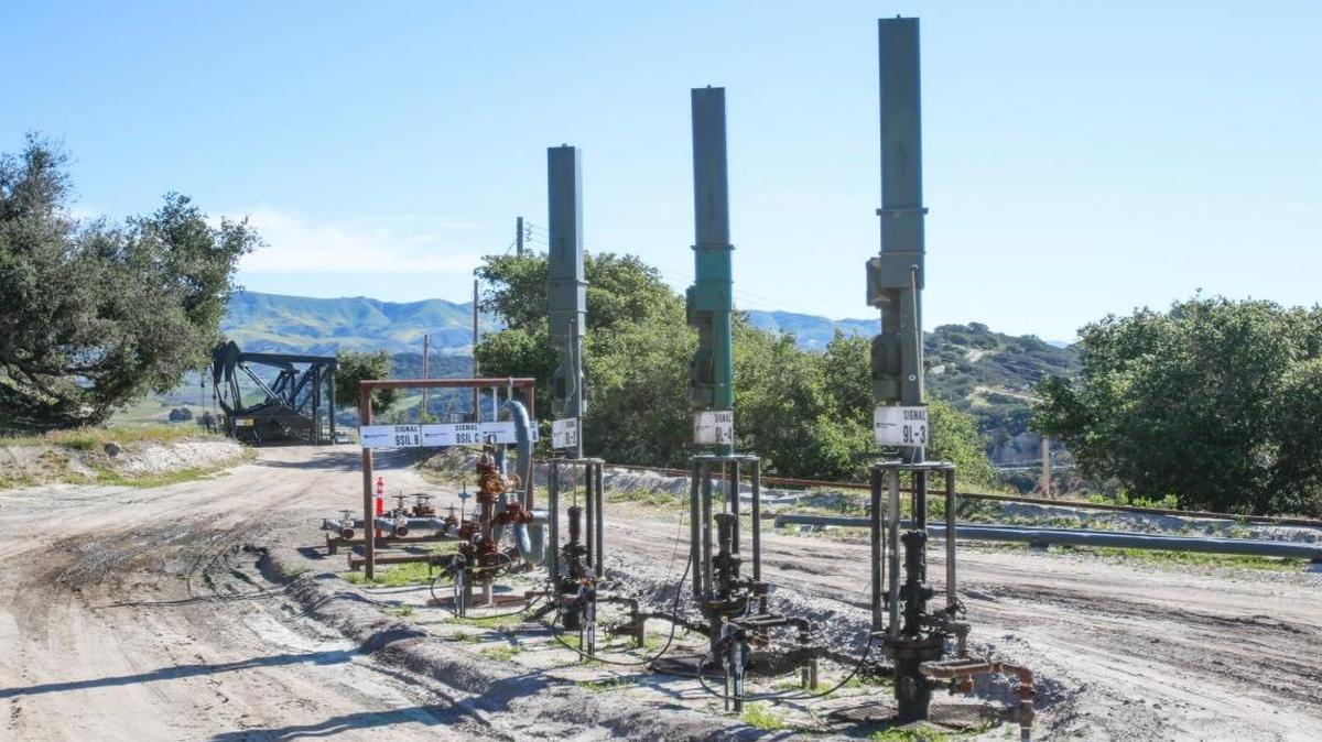 The Price Canyon oil field, where linear rod pumps in the foreground are the modern replacement for the conventional pumping units in the background.