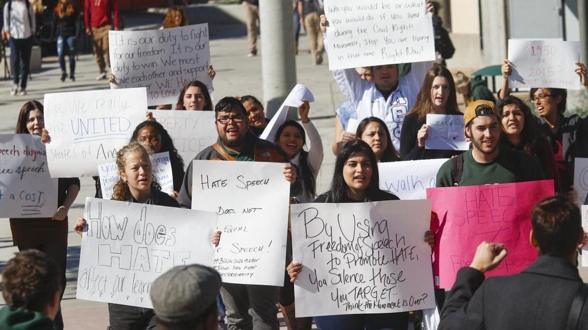Cal Poly students march in protest at the University Union Plaza on Thursday in reaction to derogatory comments targeting Muslim and transgender people on a “Free Speech Wall” erected by the campus Republican club.