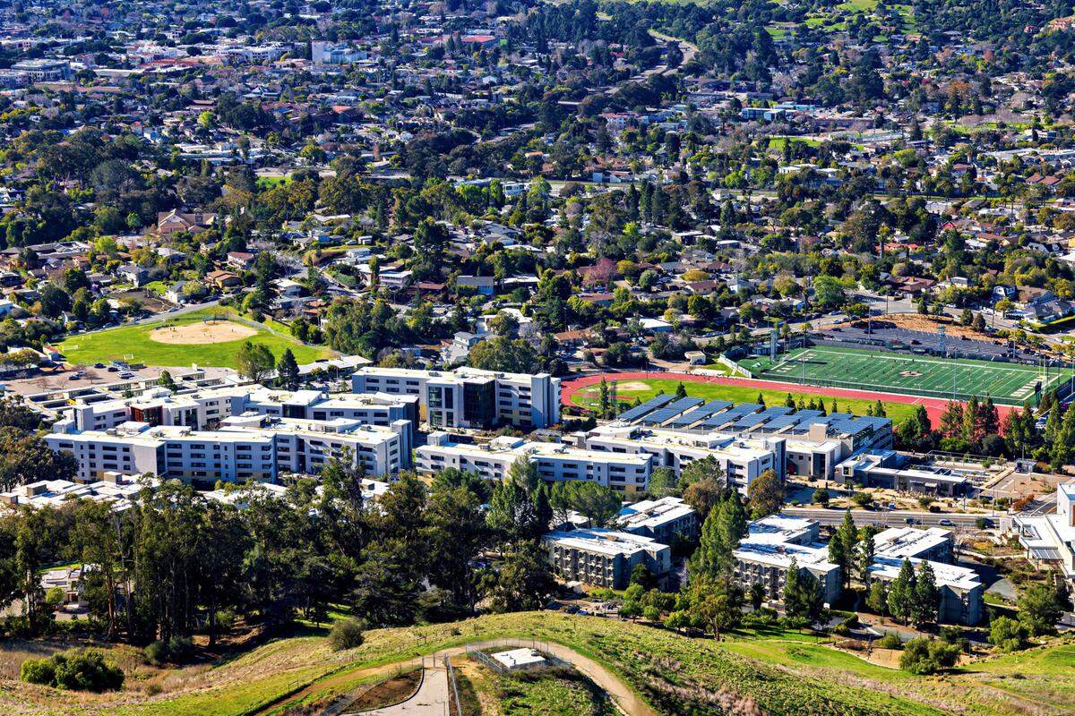 The Grand Avenue entrance to Cal Poly is lined by residence halls on both sides.