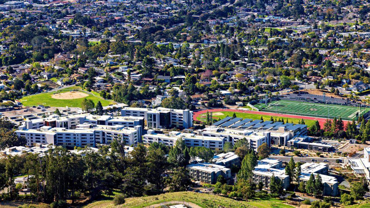 The Grand Avenue entrance to Cal Poly is lined by residence halls on both sides.