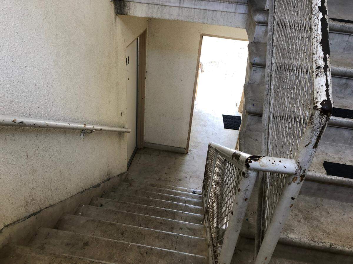 A worn staircase accesses second-floor units at Grand View Apartments in Paso Robles.