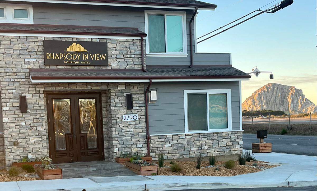 The seven custom rooms in Morro Bay’s new Rhapsody in View boutique hotel, with its Art Deco entrance, have a commanding view of Morro Rock and the sea.