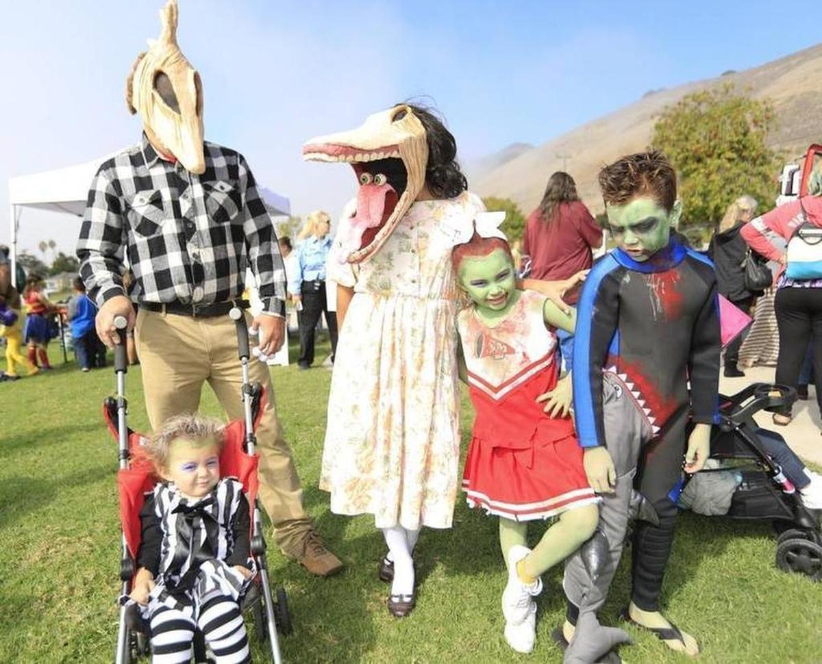 Justus and Francesca Erickson are the dead couple from “Beetlejuice”; daughter Eva, 6, is a dead cheerleader; son Jason, 8, is a dead surfer; and daughter, Nicole, 1, is dressed as Beetlejuice at Pumpkins in the Park in Pismo Beach on Saturday, October 28, 2017.
