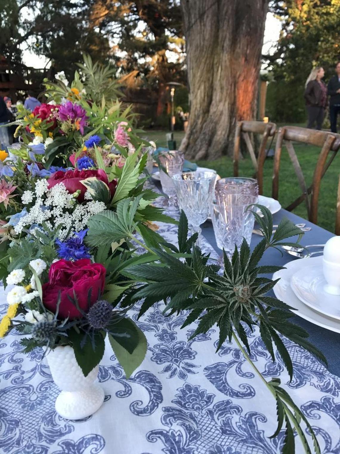 Table bouquets featuring marijuana leaves by Sprigs Floral Designs were on display at a cannabis-infused wedding event Tuesday in San Luis Obispo.
