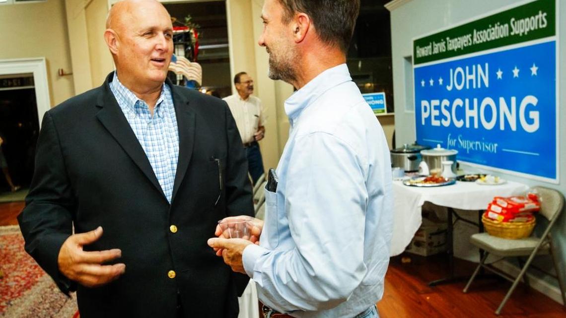 John Peschong, left, talking here with supporter Bronco Rudnick at Peschong’s primary election night party in Paso Robles, says he will recuse himself from voting on the Phillips 66 oil-by-rail project in Nipomo because of work his firm has done for the oil company.
