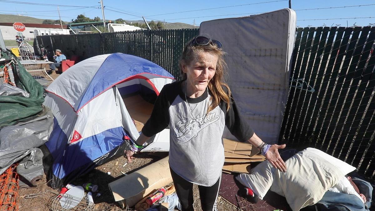 Renee Askew clears out her belongings and those of others. A homeless camp off of Prado Road on the access road to the San Luis Obispo waste water treatment plant was cleared Jan. 24, 2022. Homeless advocates and the evicted asked where they could move. The city officials said the road used as construction access was not a safe location.