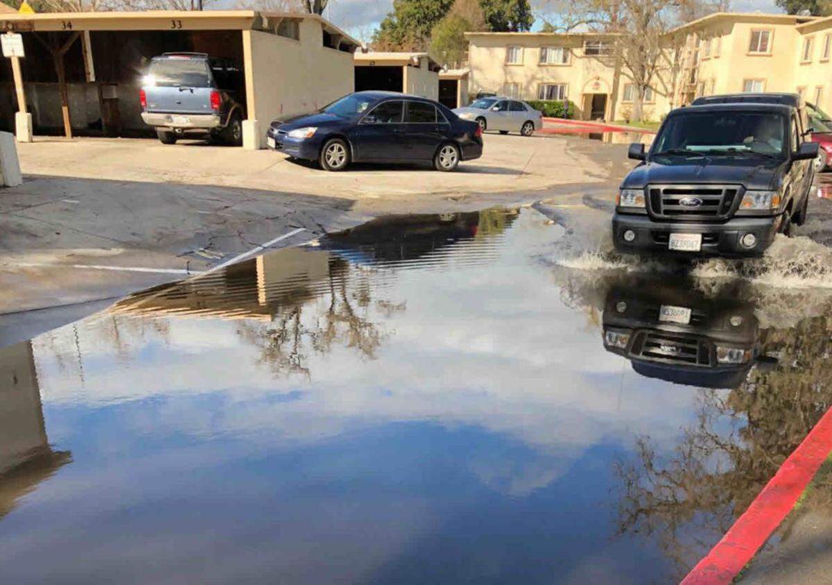 A Paso Robles city staffer sent a photo of deep stagnant water in the parking lot of Grand View Apartments to Building Director Brian Cowen, asking if anything could be done. City emails show Cowen declined to look into the flooding.