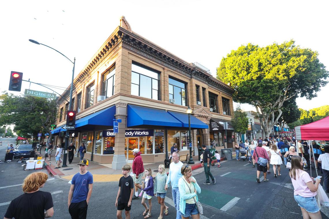 Crowds stroll along Higuera Street during Farmers Market on Thursday, Oct. 1, 2021. 