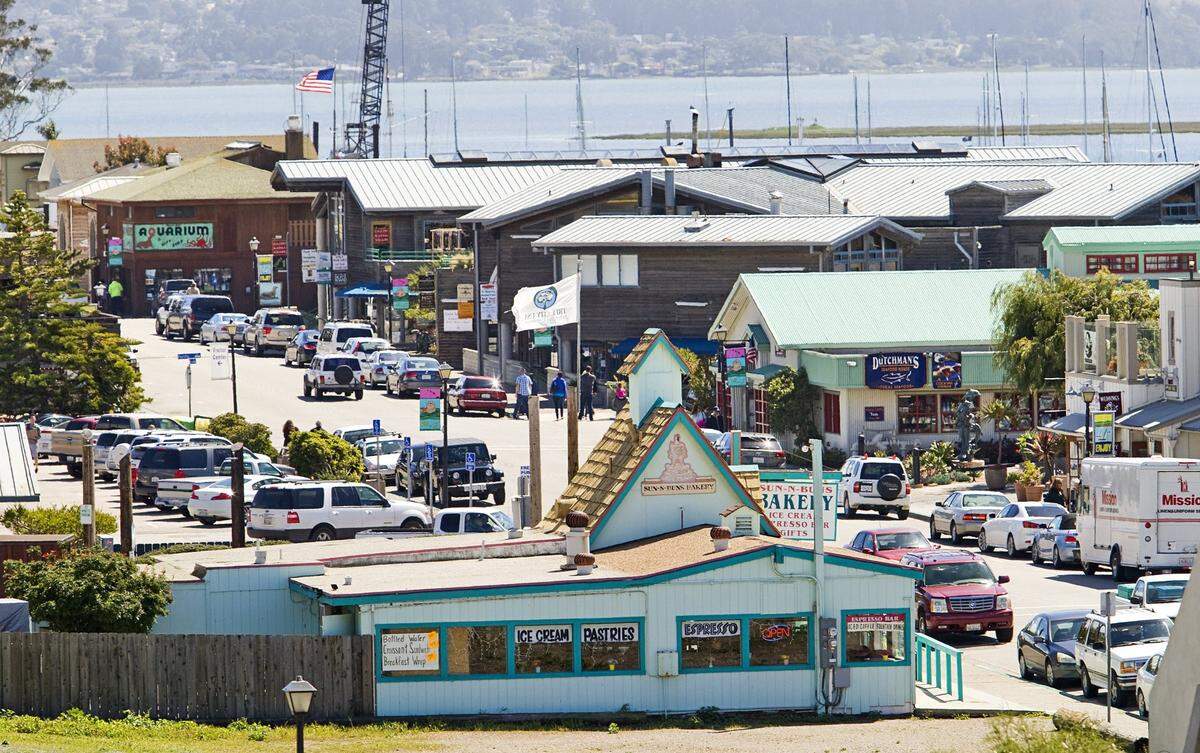 Cars fill streetside parking along the Embarcadero in Morro Bay.