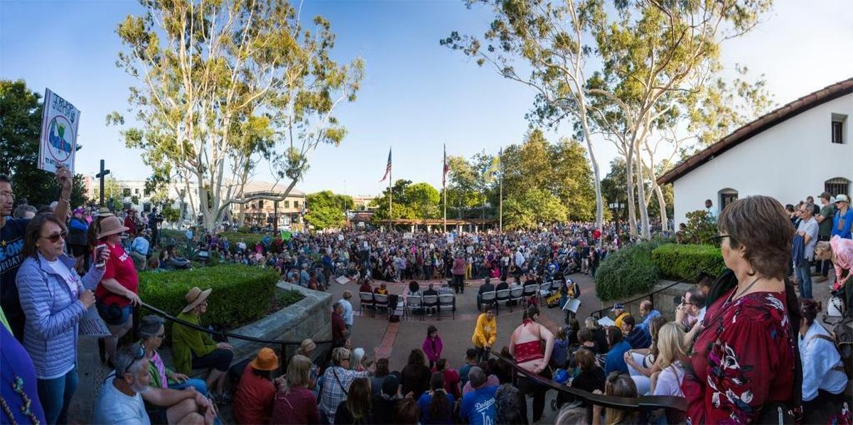 About a 1,000 people turned out for a vigil at Mission Plaza in honor of the victims of white nationalist violence in Charlottesville, Virginia.