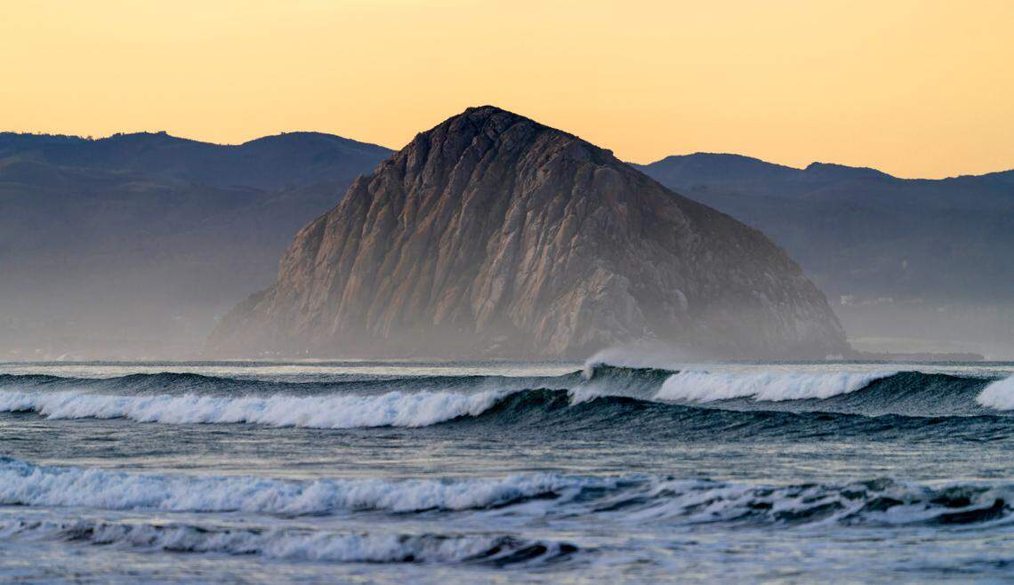 Waves crash near Morro Rock.
