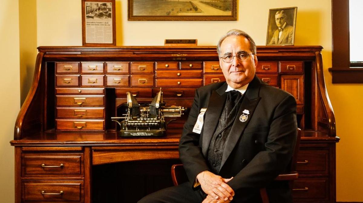 Atascadero Mayor Tom O’Malley in front of Atascadero founder E.G. Lewis’ desk in his office at City Hall.