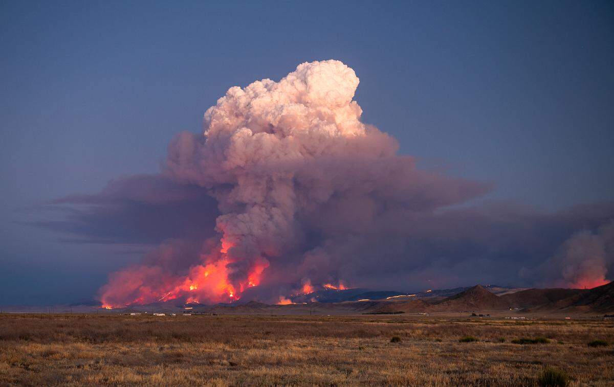 Flames from the Madre Fire send a towering plume of smoke into the sky in eastern San Luis Obispo County on July 2, 2025.