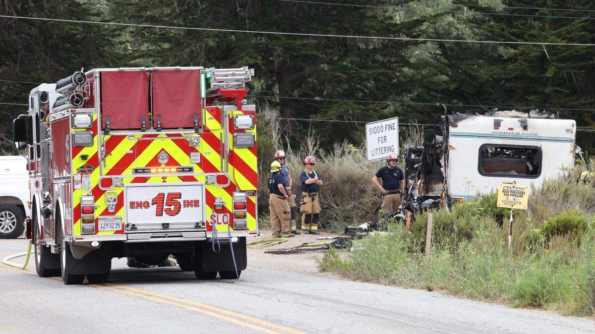 Cal Fire firefighters and San Luis Obispo County Sheriff’s Office deputies respond to a fire involving a recreational vehicle on Turri Road in Los Osos on Monday, Aug. 21, 2023.