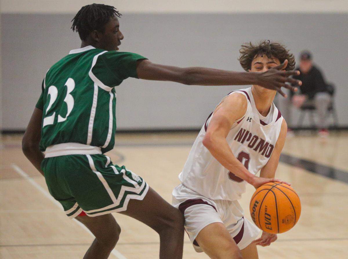 Trevon Carter Givens defends against Lucca Hart. Nipomo won 65-56 over Templeton in a boys playoff basketball game Feb. 17, 2023.