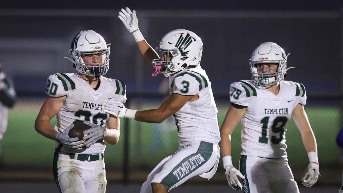 Tyler Cunningham, left, is congratulated by Armando Soto after scoring, Will Capaci is at right. Templeton beat Morro Bay 41-30 in a football game Oct. 11, 2024.