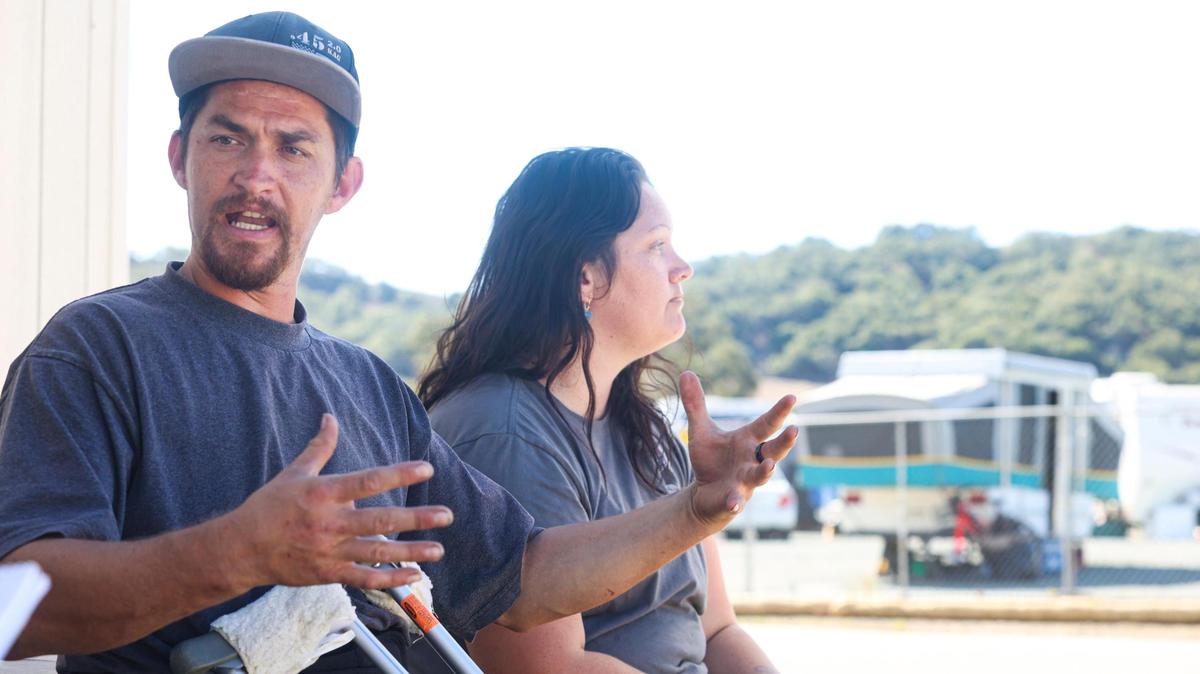 Nicholas Watson and Amanda Tanner moved to the safe parking area off Kansas Avenue from a hotel where they’d been staying with their four children after they lost their housing in Atascadero. The couple has tried to build a sense of community at the site by getting to know their neighbors. Recently, they helped those living nearby repair their RVs following a rainstorm.