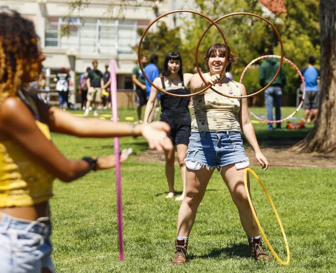 Members of Cal Poly hula hooping club The Merry Hoopsters perform on Dexter Lawn on campus.