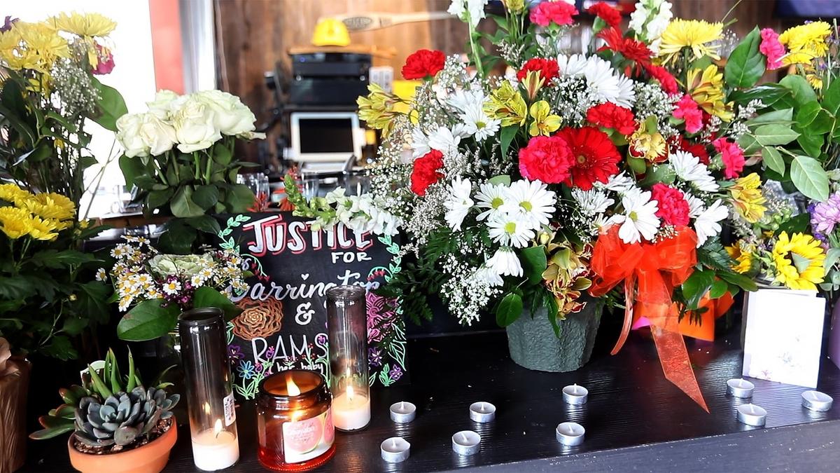 A small shrine with flowers and candles was on display at the candlelight vigil for Carrington Broussard at Rock ‘N’ Robles Grill and Pizza Kitchen on Sunday, March 10, 2019.