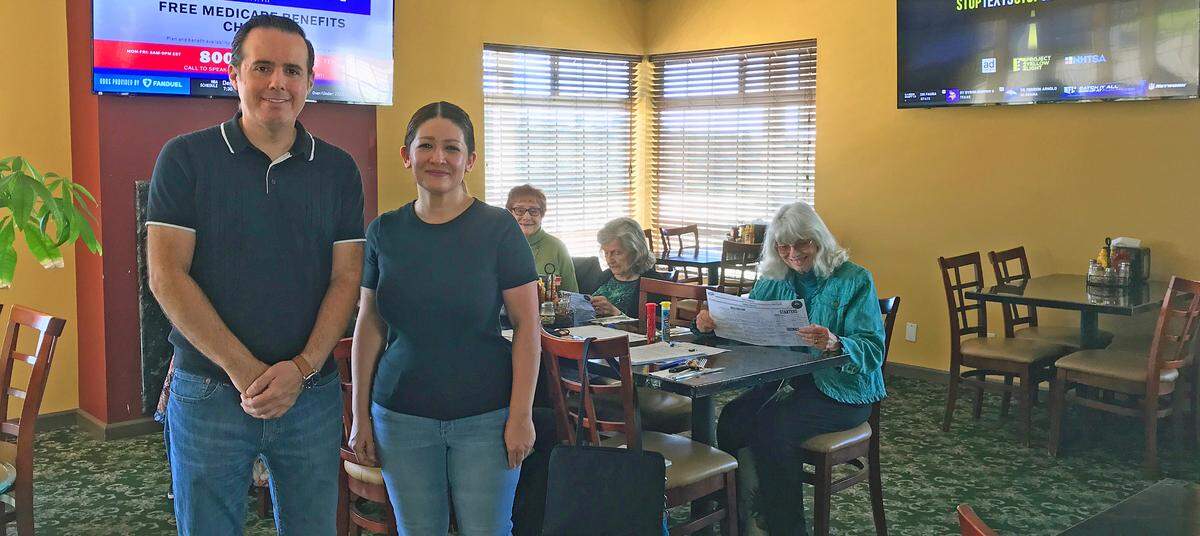 Luis and Claudia Plascencia, owners of Luigi’s Pizza in Cambria, take a break while a ladies lunch group decides about what each of them will order. At the table are Marylyn Villeneuve at left, Marge Clark and Gayle Oksen. The group of seven eventually selected individual pizzas, sandwiches, salads and more.