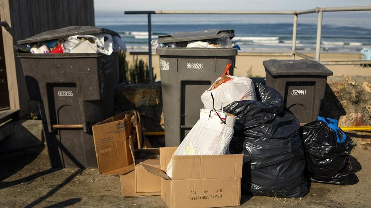 Trash waits to be picked up on July 5, 2017, on Cypress Street in Pismo Beach.