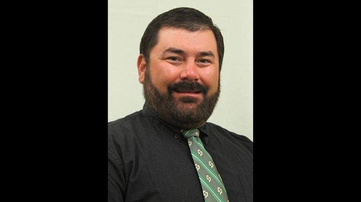 Phil Yoshida, head coach of Cal Poly’s swim and dive team, has been place on paid leave while the university investigates allegations of misconduct.