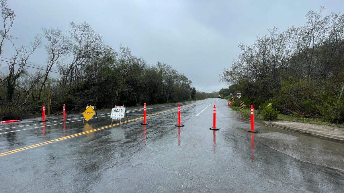 Road signs block off South Bay Boulevard in Morro Bay during a March 10, 2023 storm.