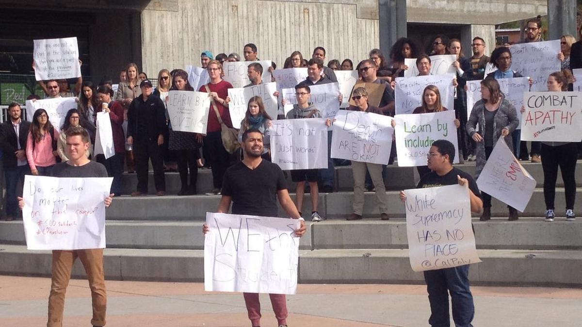 Cal Poly’s SLO Solidarity group rallies in December in the wake of an alleged death threat against one of its leaders, Matt Klepfe. A Cal Poly student on Wednesday found his Poly Canyon Village apartment door defaced with swastikas and racial and homophobic slurs.