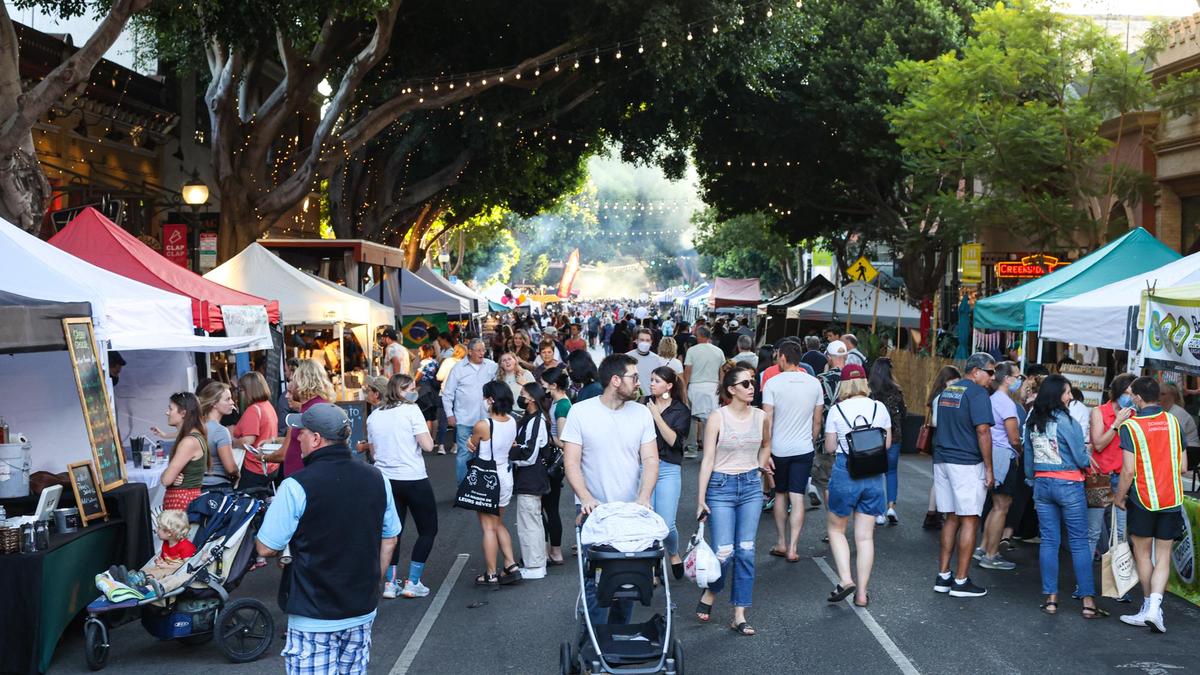 Crowds fill Higuera Street during the Downtown Thursday Night Farmers Market on Oct. 1, 2021.