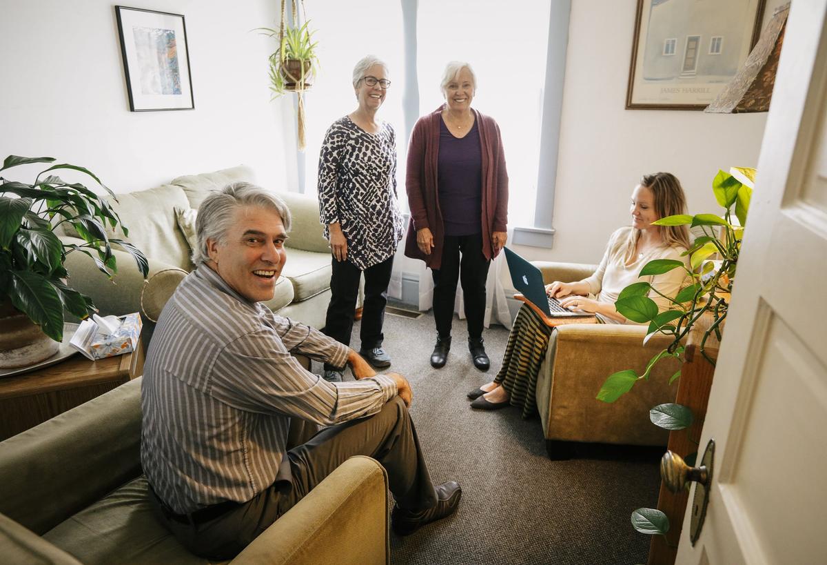 Volunteer therapist Dr. Steve Kadin, left, cabinet members Dr. Elie Axelroth, and Irene Iwan, and volunteer therapist Dr. Jamie Hutchcraft at the Community Counseling Center in San Luis Obispo.
