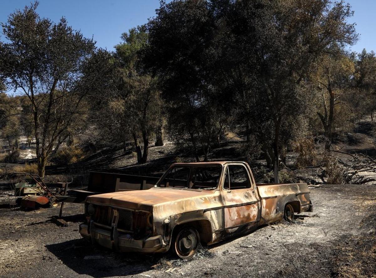 A burned-out truck sits near the home of Lisa and Mickey Bruce, which was destroyed by the Hill Fire on Stagecoach Canyon Road in Santa Margarita.
