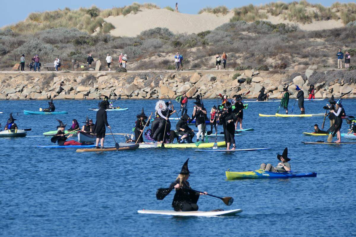 Hundreds of people turned out for the 10th annual Witches and Warlocks Paddle in Morro Bay on Oct. 29, 2023.